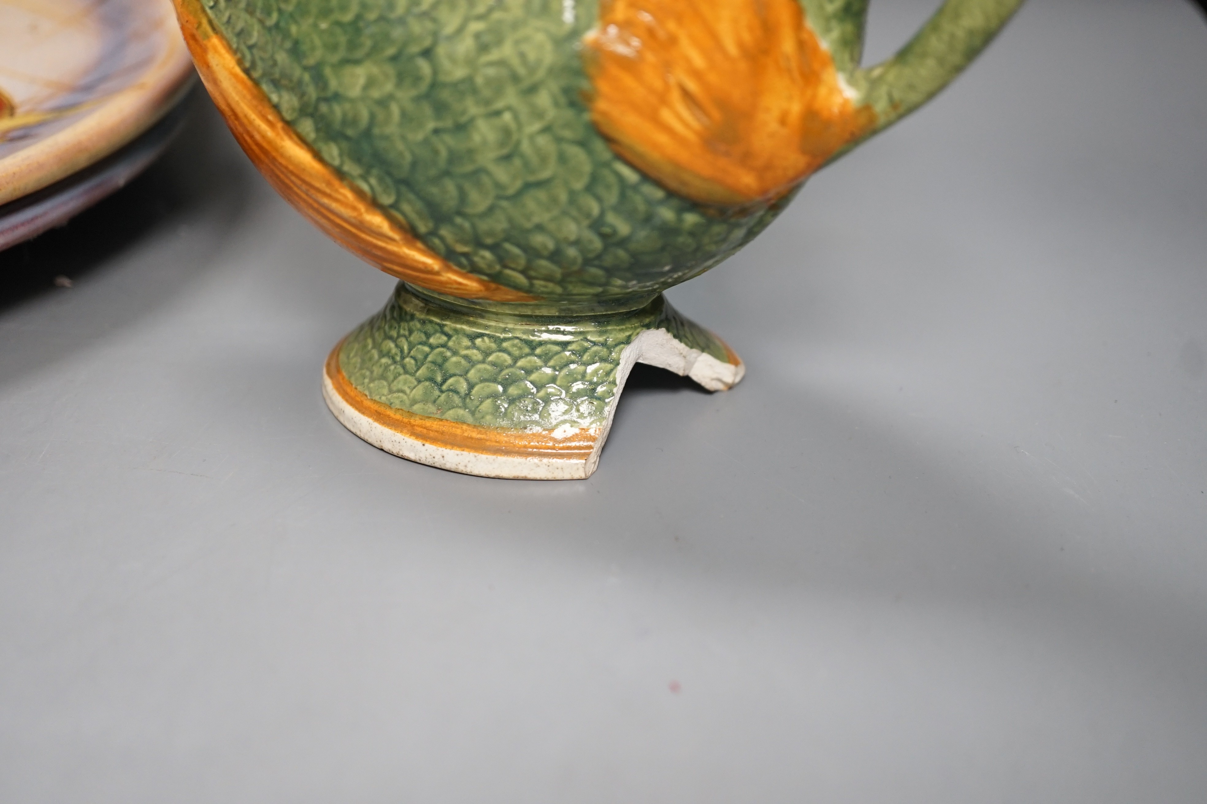 A selection of ceramics, to include two Vallauris plates, a bust of Madonna and child signed ‘Helen Fraser Rock 1925’, a Dutch figure and a pair of turquoise glazed cats etc.